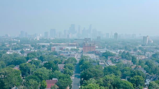 PHOTO: The Minneapolis skyline, seen from the Powderhorn Park, is obscured by wildfire smoke during the air quality alert, June 28, 2023, in Minneapolis. (Kerem Yucel/Minnesota Public Radio via AP)