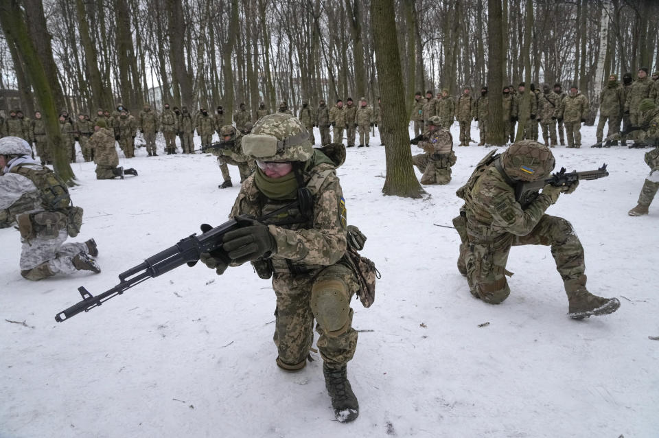 Members of Ukraine's Territorial Defense Forces, volunteer military units of the Armed Forces, train in a city park in Kyiv, Ukraine, Saturday, Jan. 22, 2022. Dozens of civilians have been joining Ukraine's army reserves in recent weeks amid fears about Russian invasion. (AP Photo/Efrem Lukatsky)