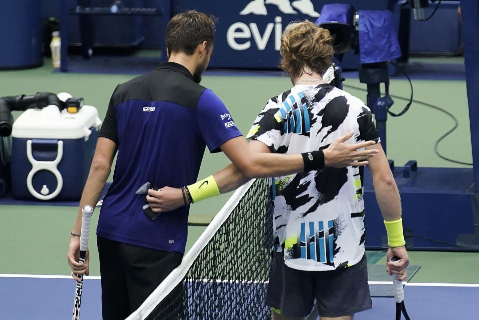 Daniil Medvedev, of Russia, left, greets Andrey Rublev, of Russia, at the net after winning their quarterfinal match of the US Open tennis championships, Wednesday, Sept. 9, 2020, in New York. (AP Photo/Seth Wenig)