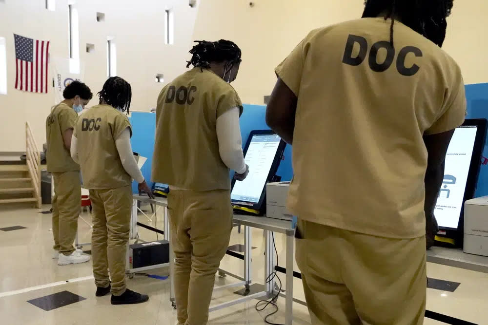 Inmates at the Cook County, Ill., jail vote in a local election at the jail’s Division 11 Chapel on Saturday, Feb. 18, 2023, in Chicago. (AP Photo/Charles Rex Arbogast)