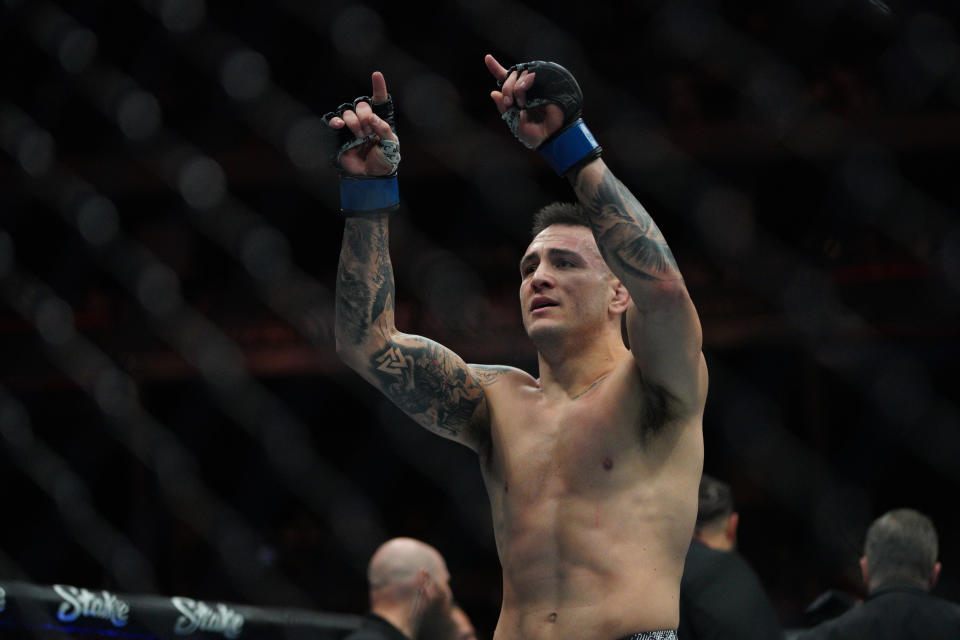 Dec 2, 2023; Austin, Texas, USA; Cody Brundage (blue gloves) reacts to defeating Zachary Reese (red gloves) during UFC Fight Night at Moody Center. Mandatory Credit: Dustin Safranek-USA TODAY Sports