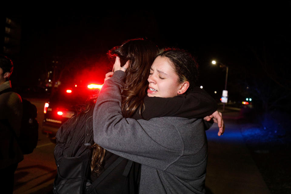 Michigan State University students hug during an active shooter situation on campus in Lansing, on Feb. 13, 2023.<span class="copyright">Bill Pugliano—Getty Images</span>