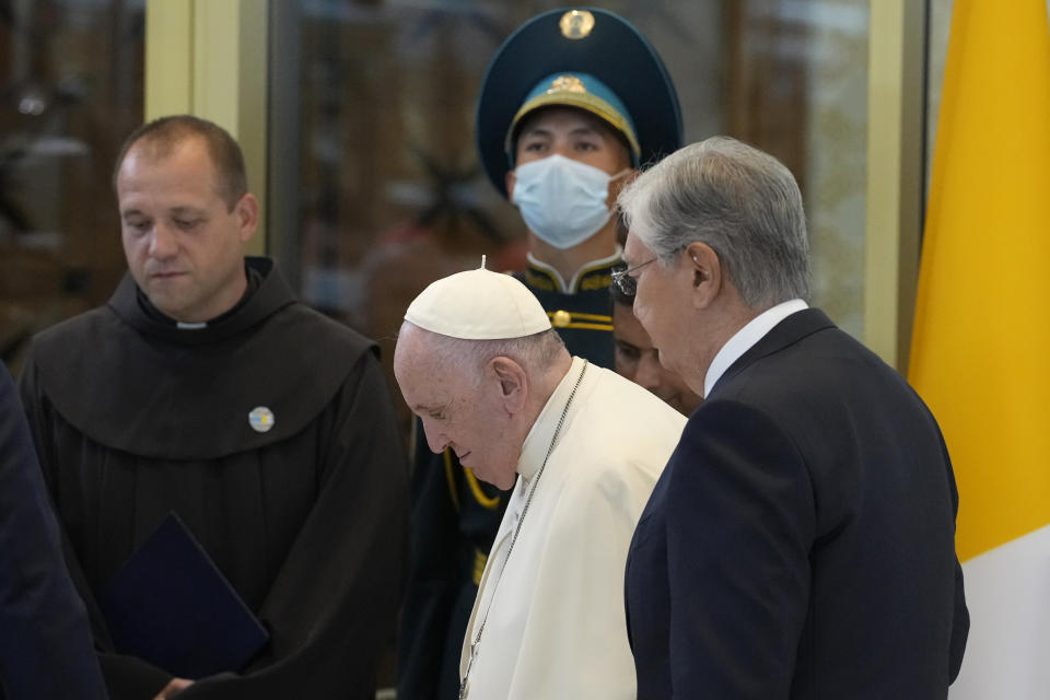 Pope Francis, left, meets the Kazakhstan's President Kassym-Jomart Tokayev as he arrives at Our-Sultan's International airport in Nur-Sultan, Kazakhstan, Tuesday, Sept. 13, 2022. Pope Francis begins a 3-days visit to the majority-Muslim former Soviet republic to minister to its tiny Catholic community and participate in a Kazakh-sponsored conference of world religious leaders. (AP Photo/Andrew Medichini)