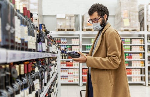   <span class="attribution"><a class="link " href="https://www.shutterstock.com/image-photo/young-man-supermarket-chooses-alcohol-wine-1779629234" rel="nofollow noopener" target="_blank" data-ylk="slk:Deman/Shutterstock;elm:context_link;itc:0;sec:content-canvas">Deman/Shutterstock</a></span>