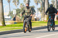 <p>Arnold Schwarzenegger takes a bike ride in L.A. on Friday wearing a camo jacket. </p>