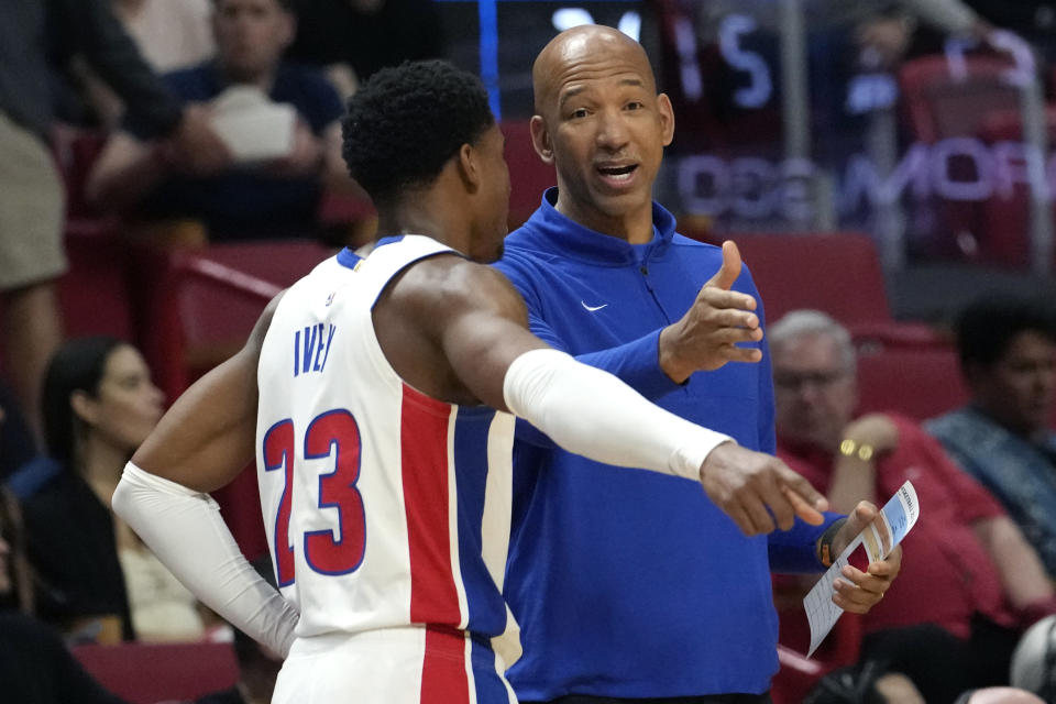 Detroit Pistons head coach Monty Williams, right, talks with guard Jaden Ivey during the first half of the team's NBA basketball game against the Miami Heat, Tuesday, March 5, 2024, in Miami. (AP Photo/Lynne Sladky)