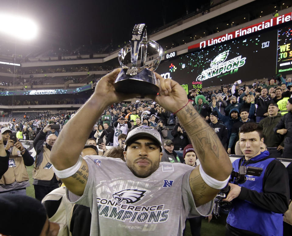 Philadelphia Eagles Mychal Kendricks holds the George Halas Trophy after the NFC championship game. (AP)