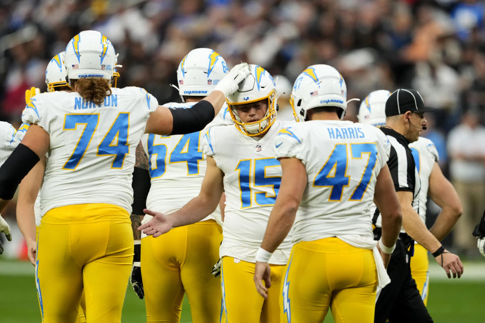 Los Angeles Chargers place kicker Cameron Dicker (15) celebrates his field goal during the first half of an NFL football game against the Las Vegas Raiders, Sunday, Dec. 4, 2022, in Las Vegas. (AP Photo/Matt York)