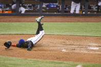 Miami Marlins' Jazz Chisholm Jr. scores on a sacrifice fly by Chad Wallach during the fourth inning of the team's baseball game against the Tampa Bay Rays, Saturday, April 3, 2021, in Miami. (AP Photo/Gaston De Cardenas)