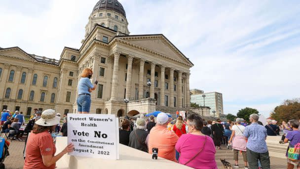 PHOTO: A woman holds a sign asking voters to vote no on an upcoming amendment to the Kansas Constitution regarding abortion during Saturday's National Women's March in Topeka, Oct. 2, 2021. (Evert Nelson/The Capital-Journal via USA Today Network, FILE)