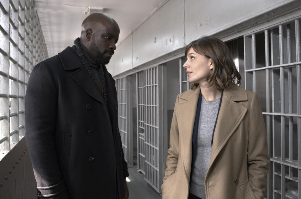 This image released by CBS shows Mike Colter, left, and Katja Herbers in a scene from "Evil," premiering Sept. 26 on CBS. (Jeff Neumann/CBS via AP)