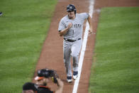 New York Yankees' Jonathan Holder runs home to score on a single by Miguel Andujar during the ninth inning of the first baseball game of a doubleheader against the Baltimore Orioles, Friday, Sept. 4, 2020, in Baltimore. The Yankees won 6-5 in nine innings. (AP Photo/Nick Wass)