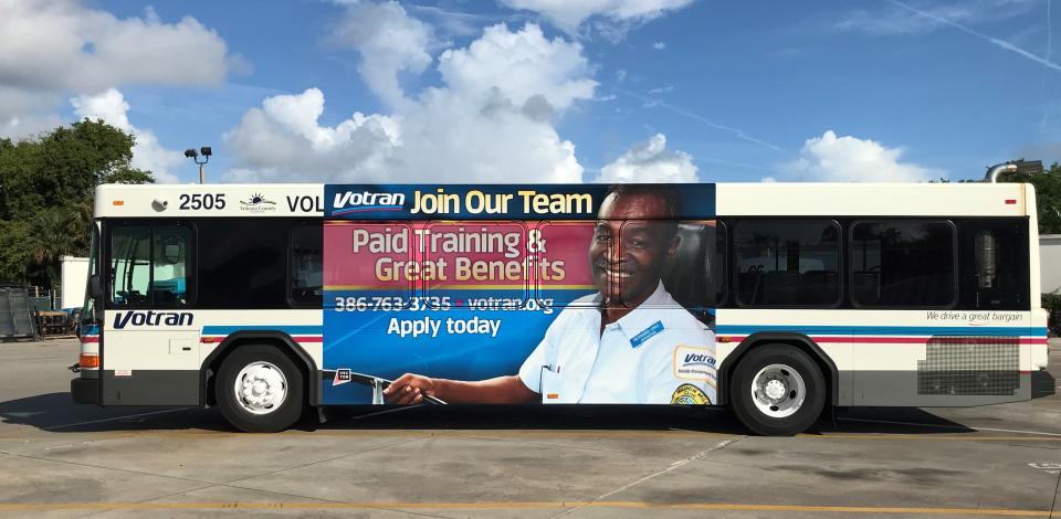 A Votran bus with driver Bernard Huggins' face on it sits at the Votran headquarters in South Daytona on Nov. 2, 2022.