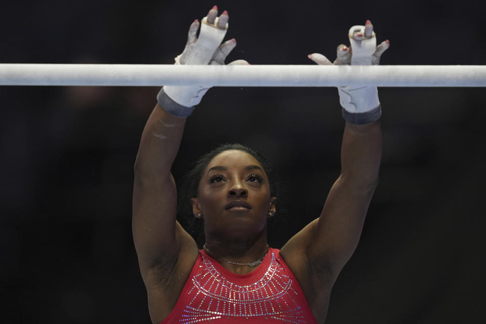 Simone Biles practices on the bars ahead of the U.S. Gymnastics Olympic Trials Wednesday, June 26, 2024, in Minneapolis. (AP Photo/Abbie Parr)