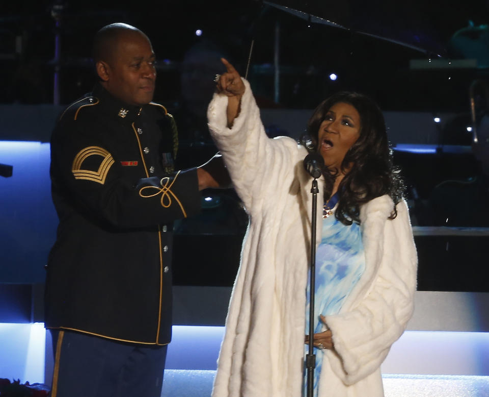 FILE - In this Dec. 6, 2013 file photo, entertainer Aretha Franklin sings at the National Christmas Tree lighting ceremony across from the White House in Washington. The legendary singer Franklin and Motown founder Berry Gordy will be honored at the 2014 BET Honors. The network announced Thursday, Jan. 16, 2014, that rapper-actor Ice Cube, American Express CEO Ken Chenault and photographer and video artist Carrie Mae Weems will also receive tributes at the event. (AP Photo/Charles Dharapak, File)