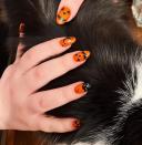 Embody the <em>spirit</em> of Halloween with jack-o'-lantern nails. Simply paint your nails your favorite shade of orange and top off with <a href="https://dashingdiva.com/products/jack-o-lantern?" rel="nofollow noopener" target="_blank" data-ylk="slk:spooky nail decals;elm:context_link;itc:0;sec:content-canvas" class="link ">spooky nail decals</a>.