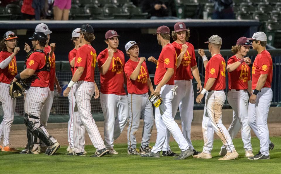 The East team celebrates after defeating the West team 6-2 in the large schools game of the 30th annual McDonald’s All-Star series Tuesday, June 22, 2021 at Dozer Park in Peoria.