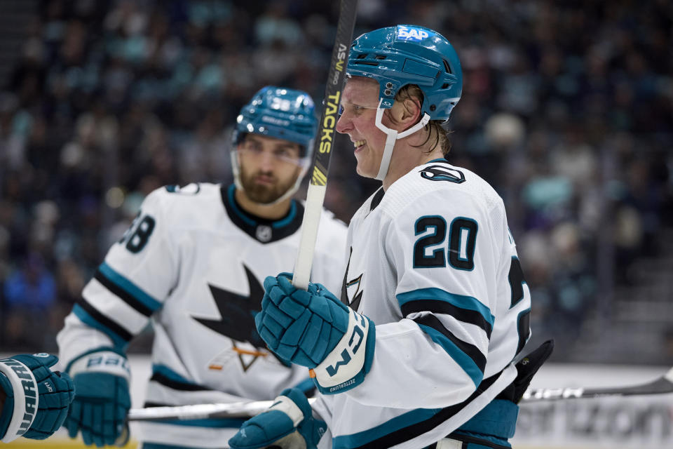 San Jose Sharks left wing Fabian Zetterlund (20) smiles after scoring against the Seattle Kraken during the second period of an NHL hockey game, Thursday, April 11, 2024, in Seattle. (AP Photo/John Froschauer)