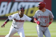 Cleveland Guardians' José Ramírez tags out Cincinnati Reds' Tyler Stephenson between first and second during the second inning of a baseball game Tuesday, May 17, 2022, in Cleveland. (AP Photo/Ron Schwane)