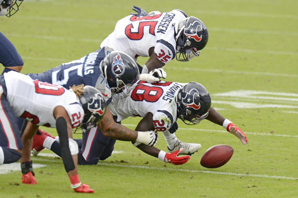 Houston Texans' Michael Thomas (28) recovers a blocked field goal attempt by the Tennessee Titans in the second half of an NFL football game Sunday, Oct. 18, 2020, in Nashville, Tenn. (AP Photo/Mark Zaleski)