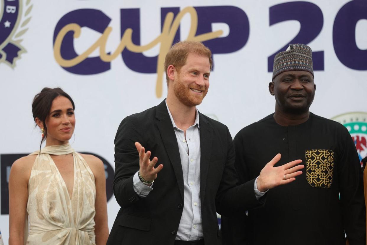 britains meghan l, duchess of sussex, britains prince harry c, duke of sussex, and nigeria chief of defense staff christopher musa r react as they pose for a photo after a charity polo game at the ikoyi polo club in lagos on may 12, 2024 as they visit nigeria as part of celebrations of invictus games anniversary photo by kola sulaimon afp photo by kola sulaimonafp via getty images