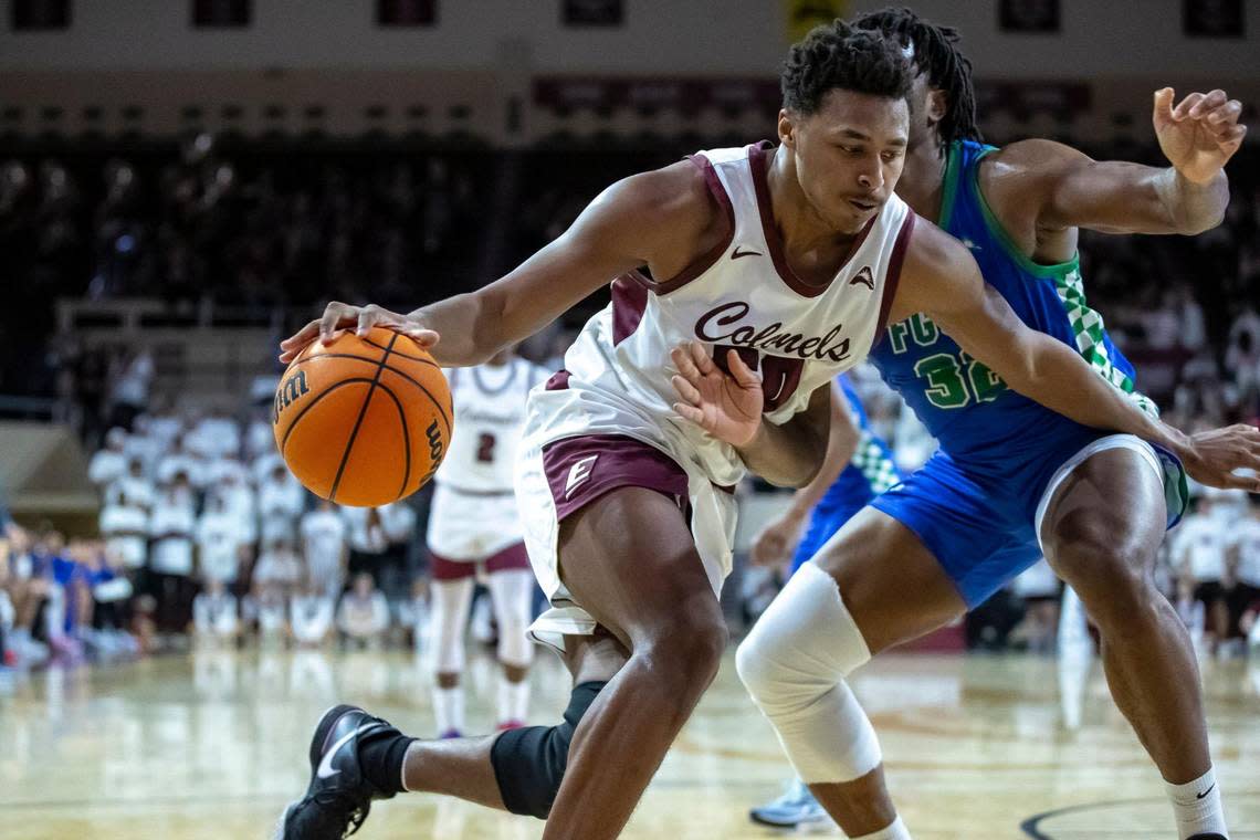 Eastern Kentucky’s Isaiah Cozart (50) drives against Florida Gulf Coast’s Keeshawn Kellman (32) in Richmond on Wednesday night. Cozart is averaging a double-double this season for EKU. Ryan C. Hermens/rhermens@herald-leader.com