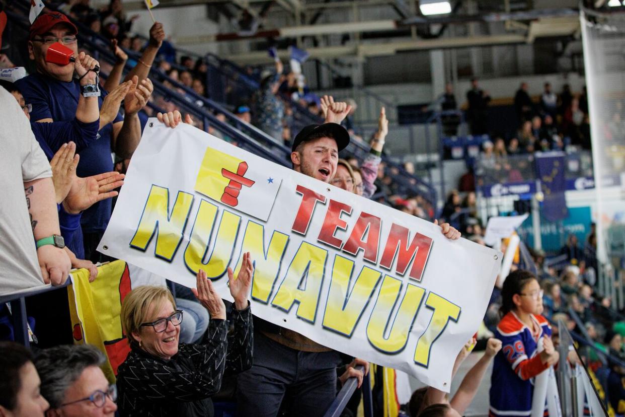 Hockey fans cheer on Team Nunavut at last year's Arctic Winter Games (AWG) in Fort McMurray, Alta. This year, dozens of Nunavut athletes are still in passport limbo just weeks ahead of the 2024 AWG in Alaska. (Evan Mitsui/CBC - image credit)