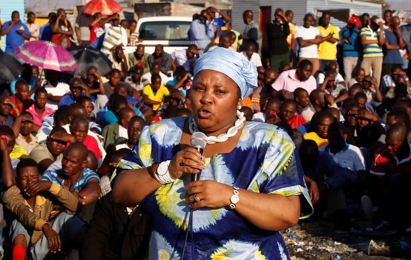 FILE PHOTO: South Africa's Minister of Defence Nosiviwe Mapisa-Nqakula addresses striking miners outside a South African mine in Rustenburg
