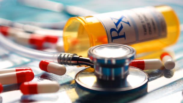 PHOTO: A stethoscope sits on a glass surface with an RX bottom and pills. (STOCK PHOTO/Getty Images)