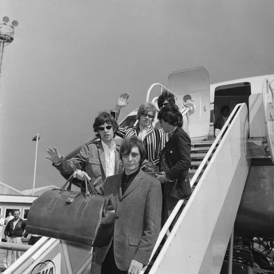 The Rolling Stones leave London Airport (now Heathrow) on a flight to New York before their fifth north American tour, 23rd June 1966. Top to bottom: Bill Wyman, Brian Jones, Keith Richards, Mick Jagger and Charlie Watts.