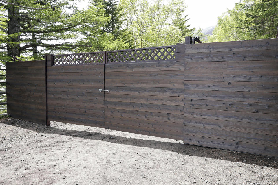 A gate at the 5th station for a trail to Mt. Fuji, is set up in Fujiyoshida, Yamanashi prefecture, Japan Monday, June 17, 2024. The crowd-control gate was installed halfway up the slope on Japan's iconic Mount Fuji on Monday ahead of the July 1 start of the climbing season. (Kyodo News via AP)