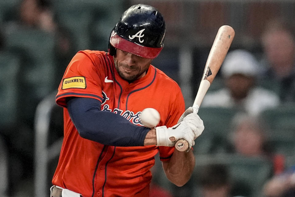 Atlanta Braves third base Austin Riley (27) is hit by a pitch against the Cleveland Guardians during the fourth inning of a baseball game, Friday, April 26, 2024, in Atlanta. (AP Photo/Mike Stewart)