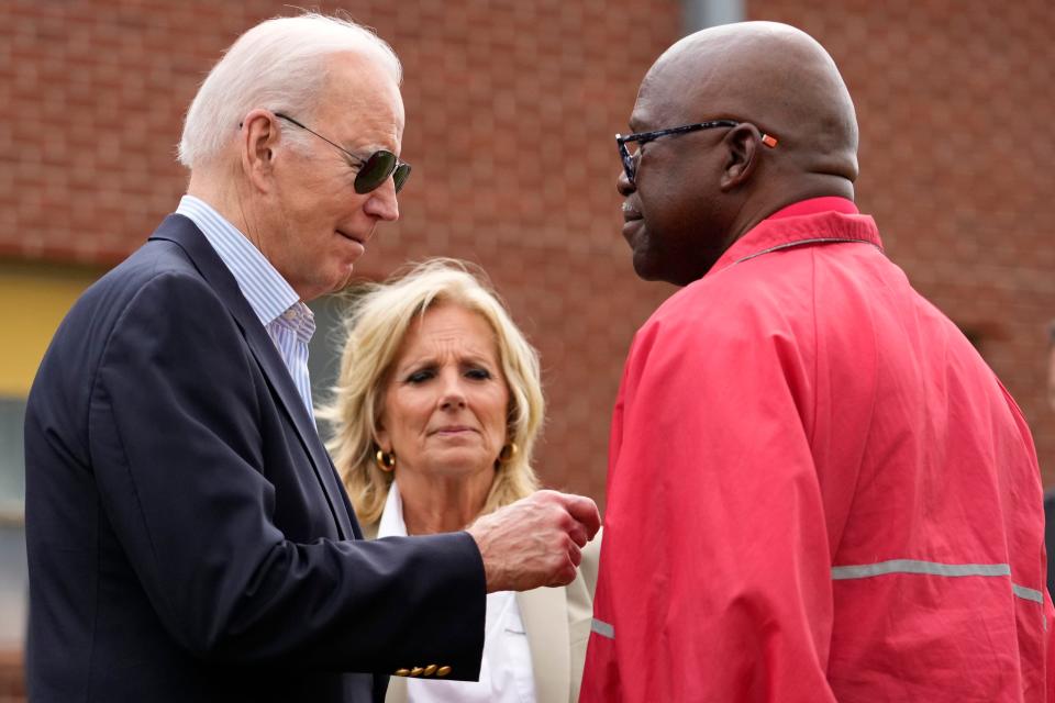 President Joe Biden talks with Rolling Fork, Miss., Mayor Eldridge Walker, right, as he and first lady Jill Biden arrive to survey the damage after a deadly tornado and severe storm moved through the area in Rolling Fork, Miss., Friday, March 31, 2023.