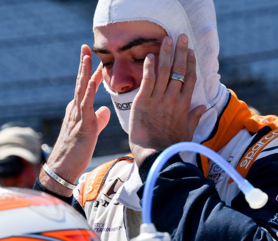 Rahal Letterman Lanigan Racing driver Jack Harvey (30) prepares to climb into his car Sunday, May 21, 2023, during the second day of qualifying ahead of the 107th running of the Indianapolis 500 at Indianapolis Motor Speedway. 