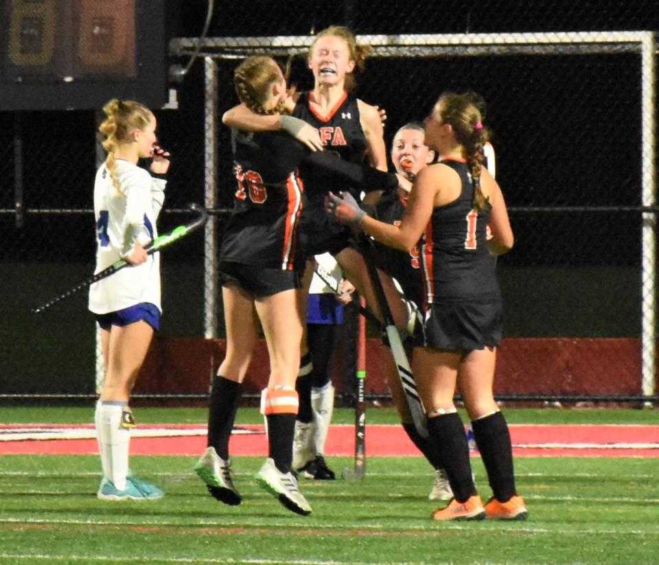 Sisters Isibeal (10) and Fiona McMahon celebrate the winning goal in overtime for the Rome Free Academy Black Knights in Section III's Class A championship game against Cicero-North Syracuse Sunday at Vernon-Verona-Sherrill High School's Sheveron Stadium.