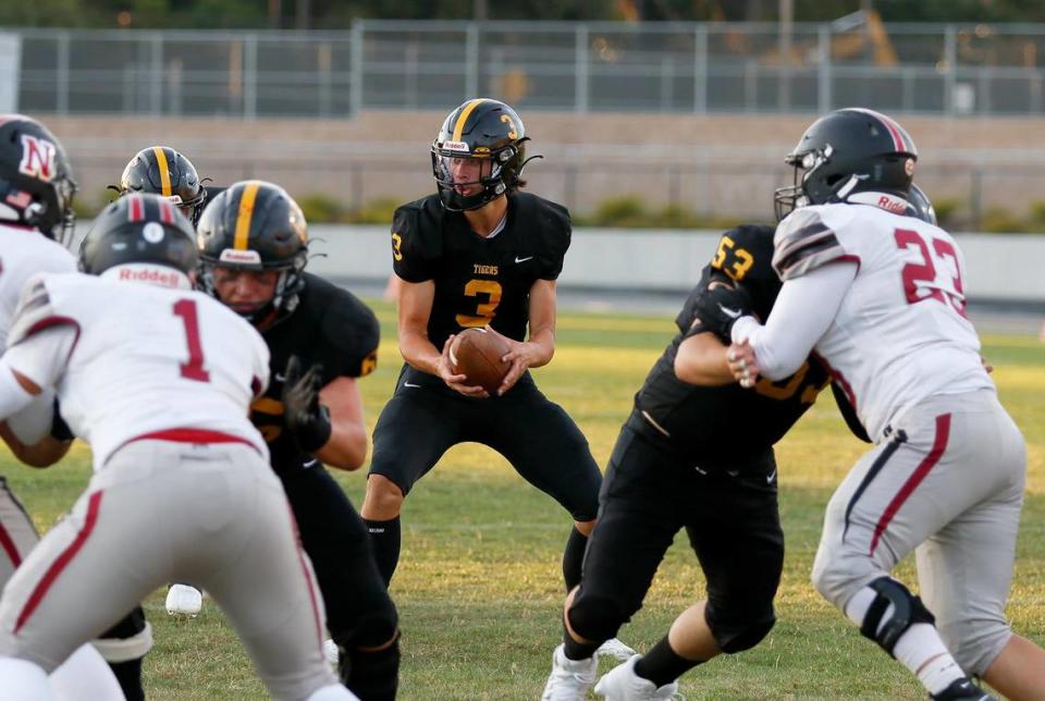 Tiger quarterback Jace Gomes (3) looks to pass. San Luis Obispo beat Nipomo 38-7 in a nonleague game at San Luis Obispo High School’s Holt Field stadium, Aug. 18, 2023.