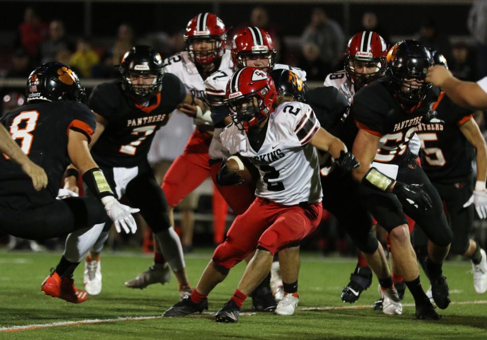 Coshocton's Cadin Whiteus looks for running room against New Lexington during a 2021 game at Jim Rockwell Stadium. Whiteus is the lone returning starter in the backfield for the Redskins this season as it hope to return to the Division V playoffs.