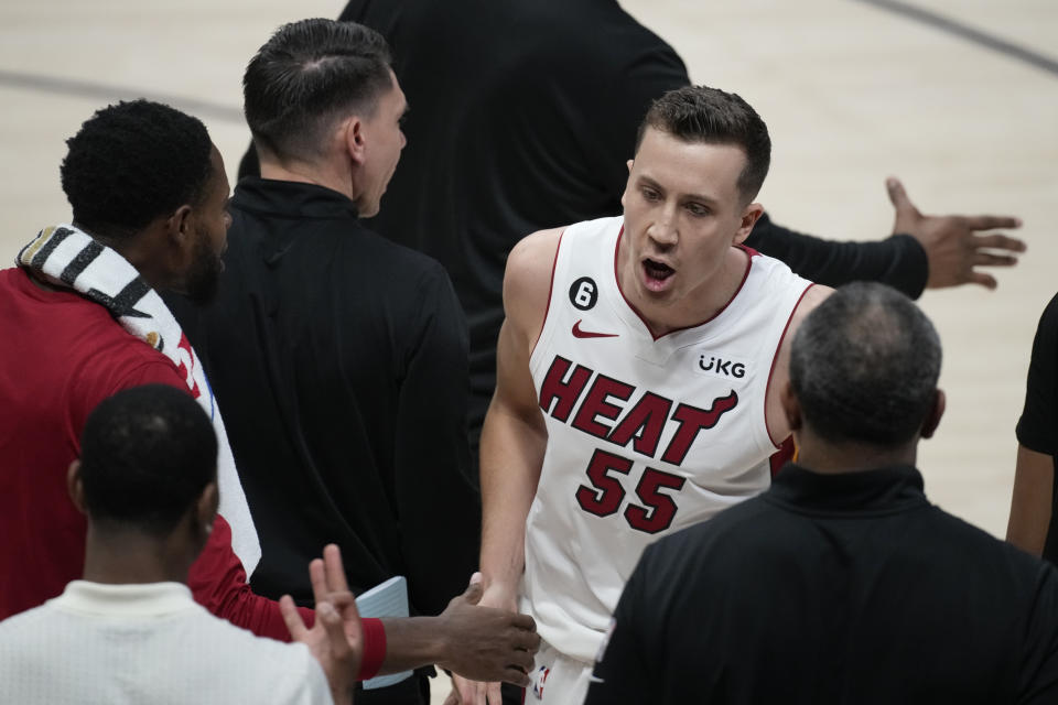 Miami Heat forward Duncan Robinson (55) reacts as he walks to the bench during the second half of Game 2 of basketball's NBA Finals against the Denver Nuggets, Sunday, June 4, 2023, in Denver. (AP Photo/David Zalubowski)