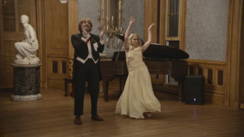 Sacha Baron Cohen and Maria Bakalova dancing in "Borat Subsequent Moviefilm"