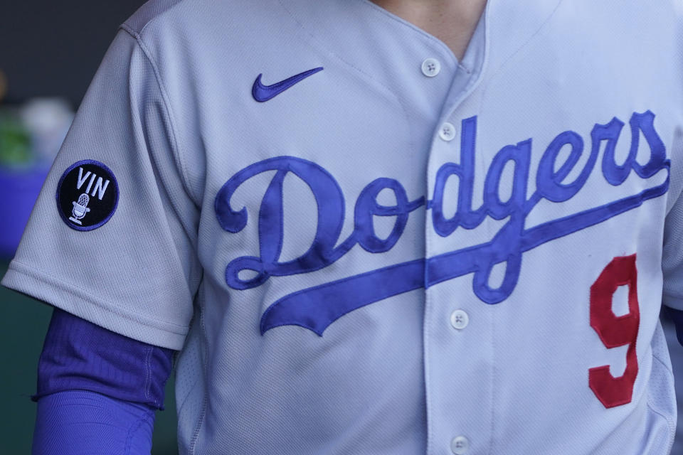 A patch honoring broadcaster Vin Scully is shown on the jersey of Los Angeles Dodgers second baseman Gavin Lux before the team's baseball game against the San Francisco Giants in San Francisco, Wednesday, Aug. 3, 2022. (AP Photo/Jeff Chiu)