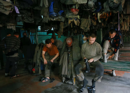 Miners prepare for their shift at the Novovolynska-9 coal mine in Novovolynsk, Ukraine August 2, 2018. Picture taken August 2, 2018. REUTERS/Valentyn Ogirenko