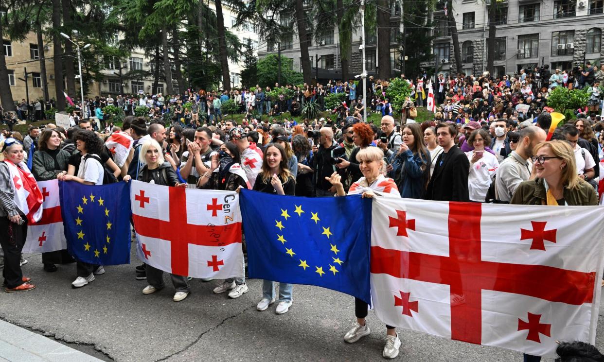 <span>Protesters demonstrate outside Georgia’s parliament as it votes to overrule President Salome Zourabichvili’s veto.</span><span>Photograph: Vano Shlamov/AFP/Getty Images</span>