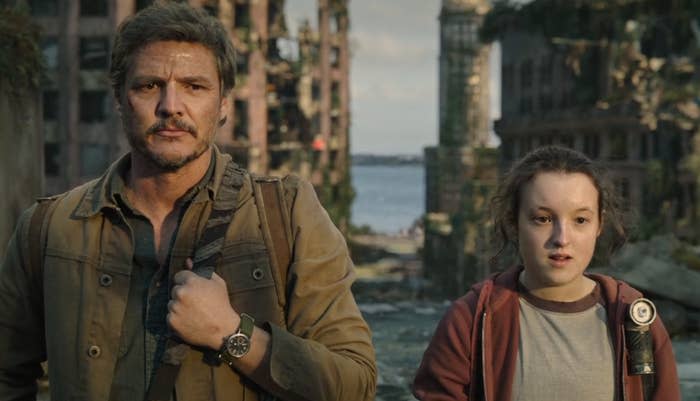 Pedro Pascal and Bella Ramsey stand in a post-apocalyptic setting for "The Last of Us" series