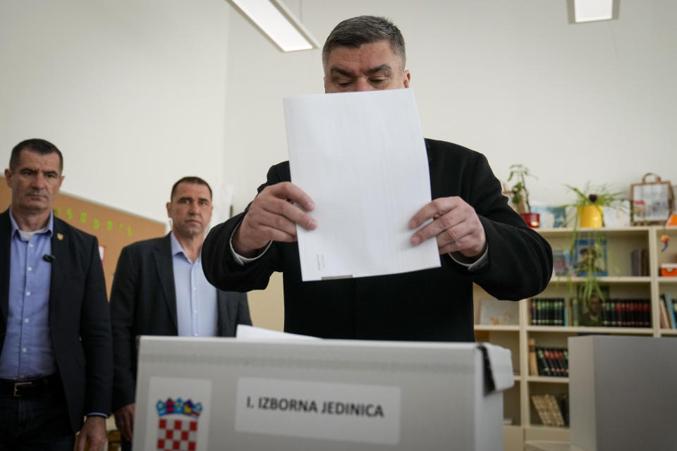 Croatia's President Zoran Milanovic casts his ballot at a polling station in Zagreb, Croatia, Wednesday, April 17, 2024. Croatia is voting in a parliamentary election after a campaign that centered on a bitter rivalry between the president and prime minister of the small European Union and NATO member. (AP Photo/Darko Bandic)