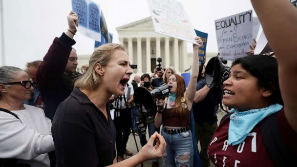 PHOTO: Pro-abortion and anti-abortion demonstrators protest outside the U.S. Supreme Court in Washington, May 3, 2022. (Evelyn Hockstein/Reuters, FILE)