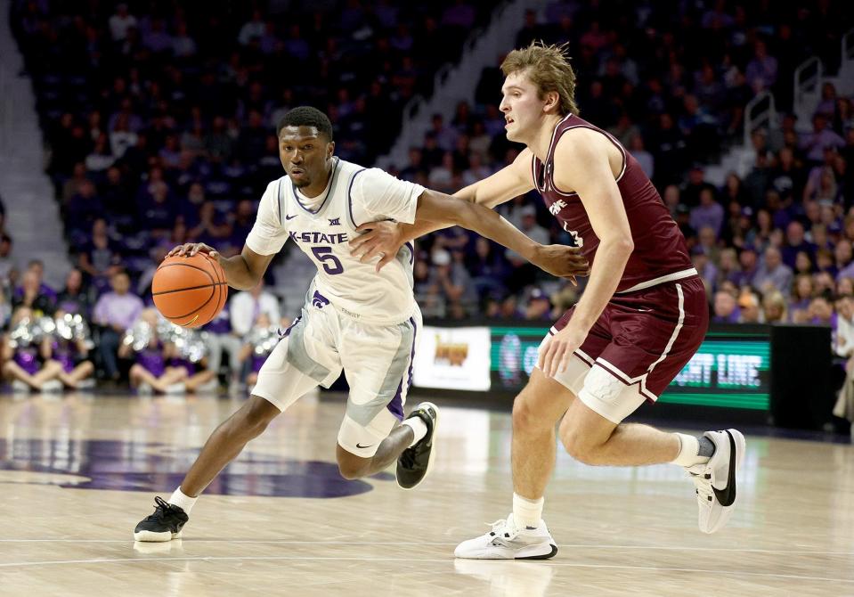 Kansas State guard Cam Carter (5) drives against Bellarmine on Friday night at Bramlage Coliseum in Manhattan.