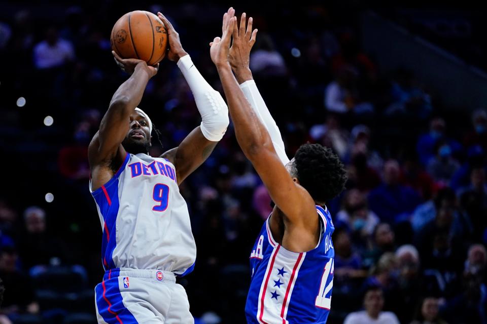 Detroit Pistons' Jerami Grant, left, goes up for a shot against Philadelphia 76ers' Tobias Harris during the first half Thursday, Oct. 28, 2021, at Wells Fargo Center in Philadelphia.