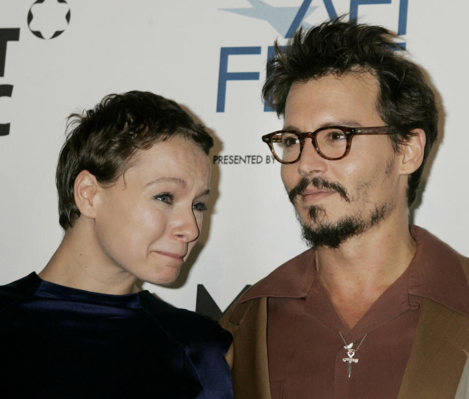 British actress Samantha Morton (L) and actor Johnny Depp pose for photographers at the world premiere of their new film 'The Libertine' during the AFI Fest 2005 in Hollywood November 11, 2005. The film released by The Weinstein Company also stars actor John Malkovich and is directed by Laurence Dunmore. REUTERS/Fred Prouser