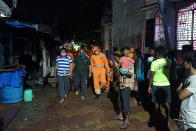 This handout photograph taken on June 3, 2020 shows NDRF personnel during the evacuation of local residents in Alibag town of Raigad district. (Photo by HANDOUT / National Disaster Response Force (NDRF) / AFP)