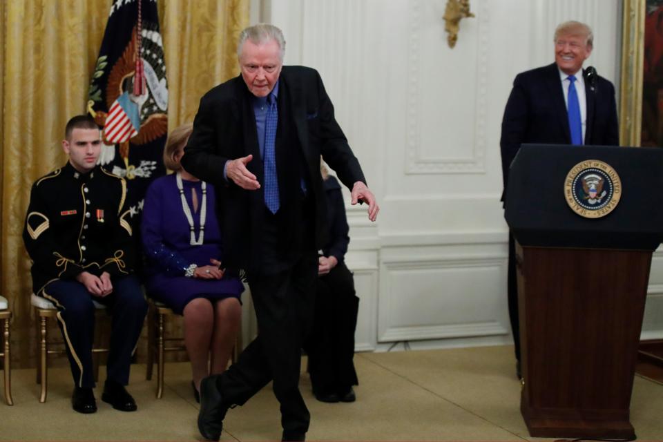 Jon Voight dances as President Donald Trump looks on during a National Medal of Arts and National Humanities Medal ceremony in the East Room of the White House, Thursday, Nov. 21.